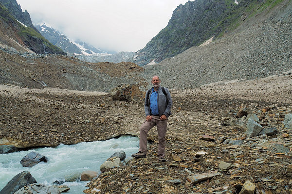 The river emerges from the dirty tongue of the glacier